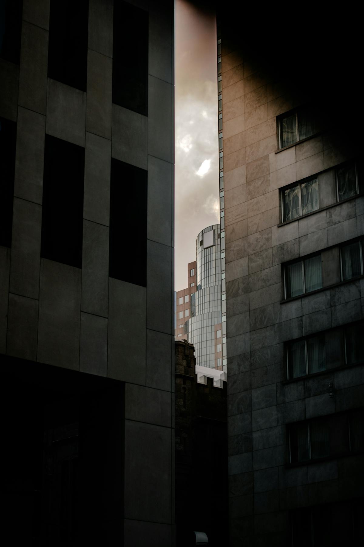 Dramatic light between urban buildings