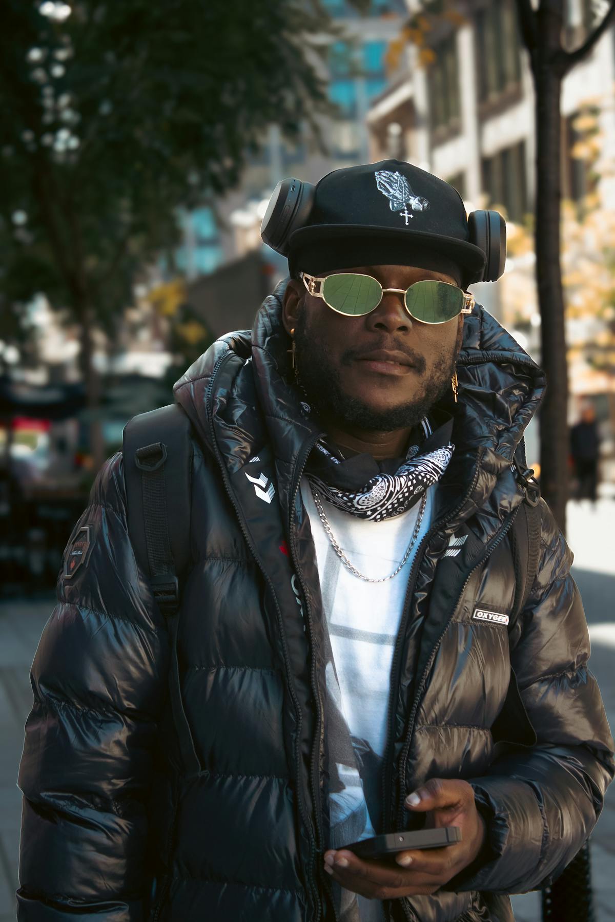 Street style portrait with sunglasses and puffer jacket
